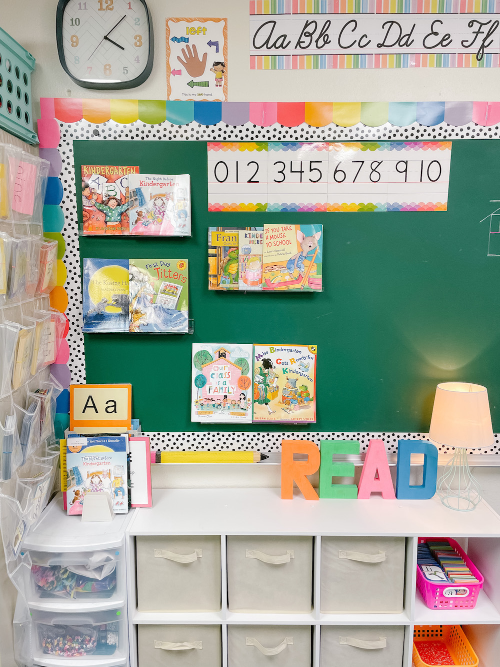Kindergarten classroom rainbow decor books on chalkboard